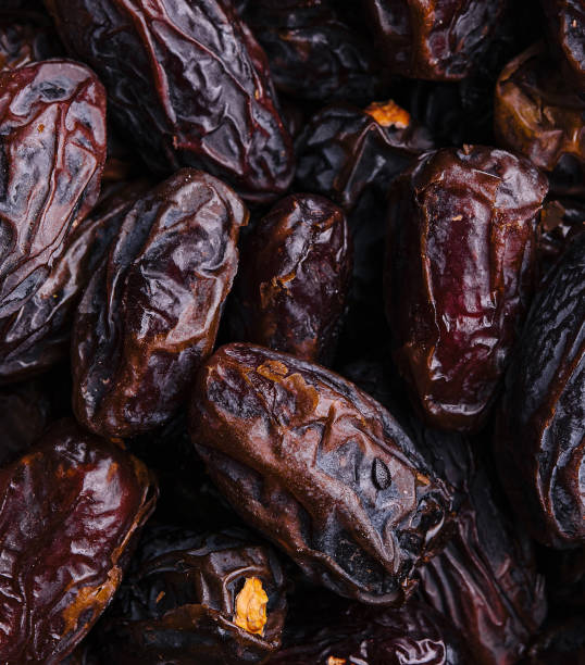 istock Fresh dates fruits close-up view 1977505140