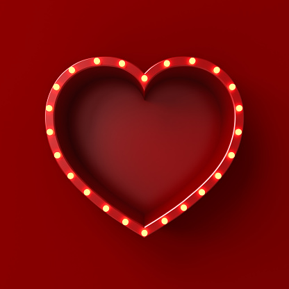 Blank red love heart shape sign box billboard with glowing yellow neon light bulbs isolated on dark red wall background with shadow minimal conceptual 3D rendering