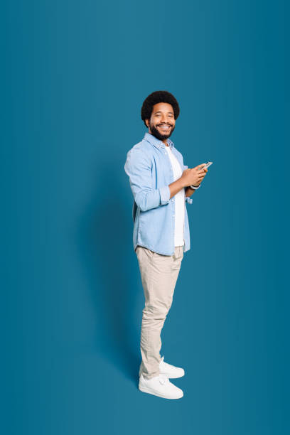istock A jovial young man holding a phone 1977507848