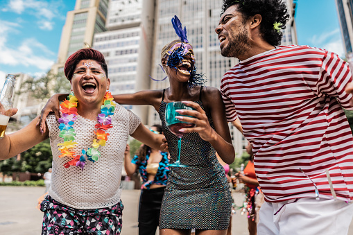 Friends having fun at a street carnival party