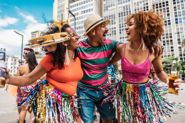 istock Friends having fun at a street carnival party 1977510241