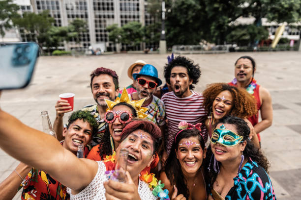 istock Friends taking a selfie on a street carnival party 1977520005
