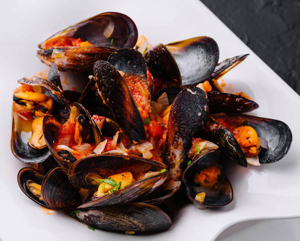 istock Mussels in tomato sauce in bowl 1977523834