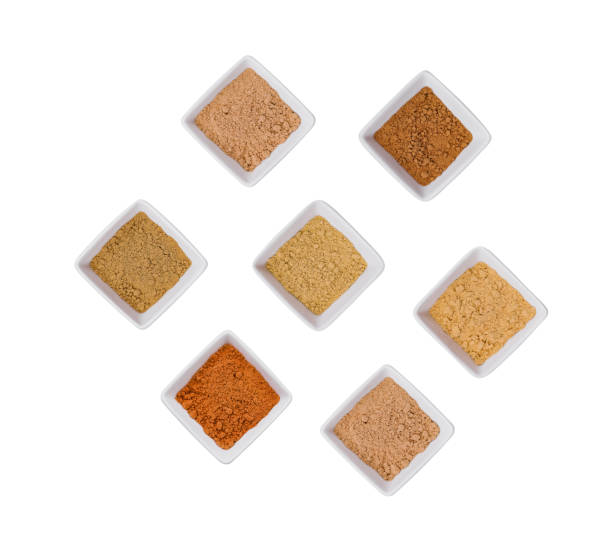 istock Various Indian Spices in Small White Bowls on white background 1977524061