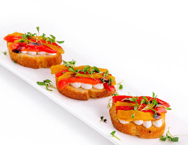 bruschetta with mozzarella and bell pepper - antipasto roasted pepper bell pepper pepper - fotografias e filmes do acervo