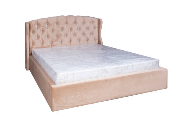 istock Double bed with soft headboard. Cushioned furniture. 1977527253