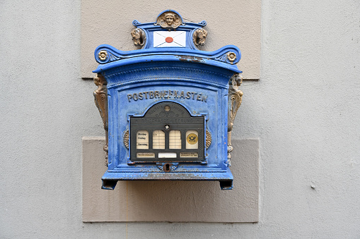 Bad Windsheim, Germany, January 25, 2024 - Old German Deutsche Post mailbox from 1896 in the historic old town of Bad Windsheim, Bavaria.