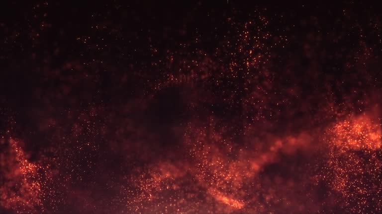 Abstract fiery gold particles flowing with bokeh effect. Golden dust particles surrounded by light splashes. Wavy golden particles flow. Shimmer particle waves at night. Bonfire feeling background.