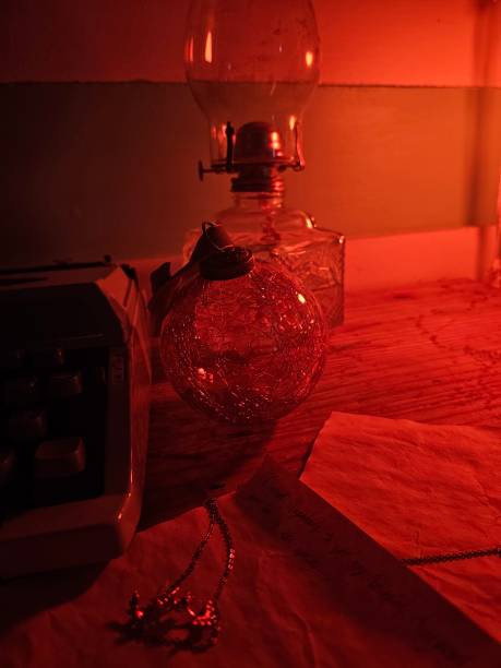 istock Still life with typewriter and oil lamp in firelight 1977600511
