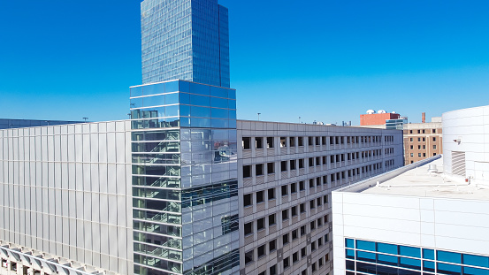 Large multilevel parking garage, multiple floors concrete buildings in downtown Oklahoma City, USA glass office, skyscraper business district, residential high-rise condo, urban metropolitan. Aerial