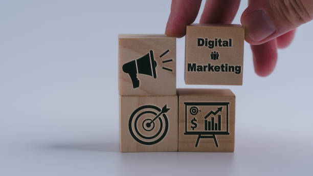 istock a wood cube block in hand putting on wooden puzzles stacking arranging completed business digital marketing goal and success plan concept 1977625464