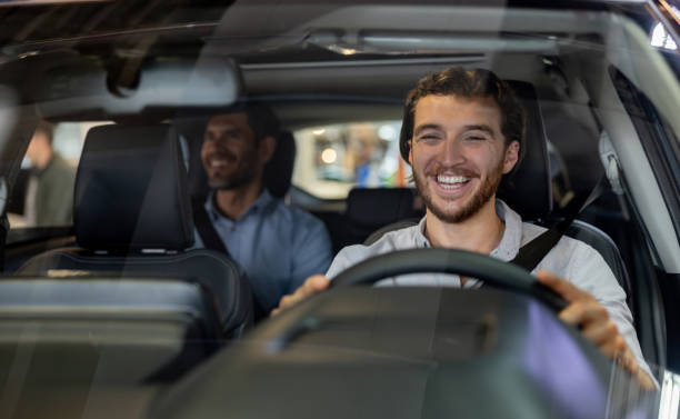 istock Happy crowdsourced taxi driver taking to a passenger 1977644908