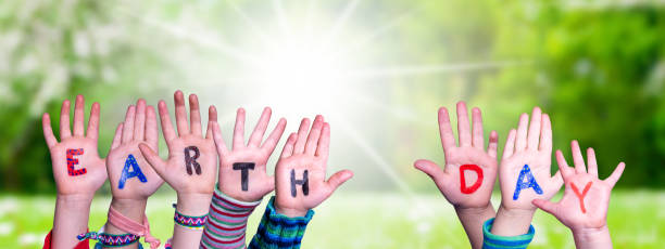 istock Children Hands Building Word Earth Day, Grass Meadow 1977659158