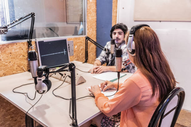 istock Young man talking to a guest on a radio show 1977676807