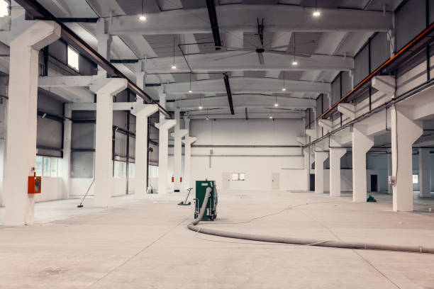 istock Work in progress in an industrial warehouse. Industrial vacuum cleaner 1977687514