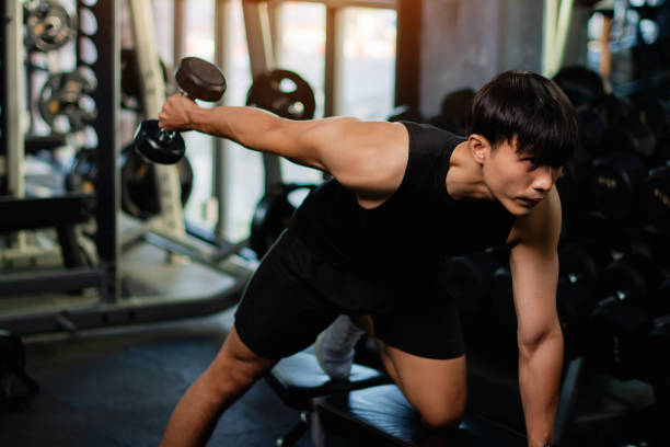 istock Lifting dumbbell exercises builds strong upper arm muscles. Exercise activities for health lovers and builds a good and strong figure. 1977691759
