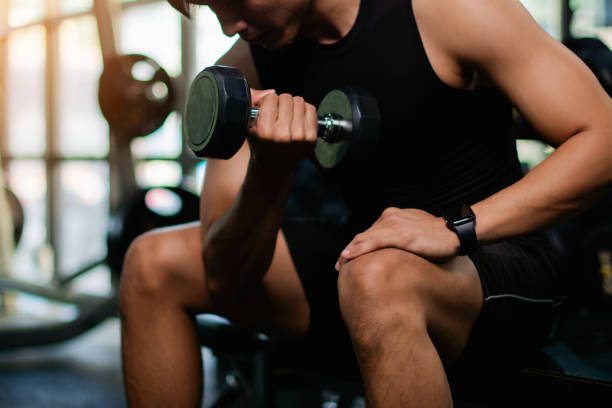 istock Lifting dumbbell exercises builds strong upper arm muscles. Exercise activities for health lovers and builds a good and strong figure. 1977691763