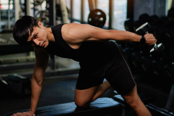 istock Lifting dumbbell exercises builds strong upper arm muscles. Exercise activities for health lovers and builds a good and strong figure. 1977691775
