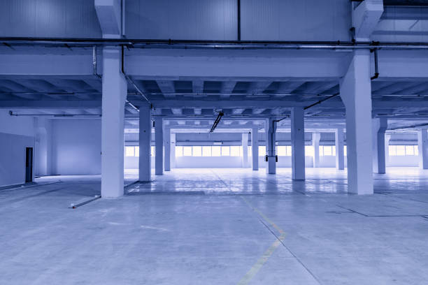 istock spacious hangar area with concrete floor and windows 1977716947