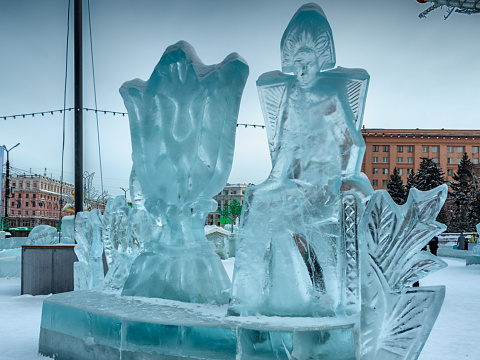 The ice sculpture stands on the square in the city center. The photo was taken on Revolution Square in Chelyabinsk, Russia.