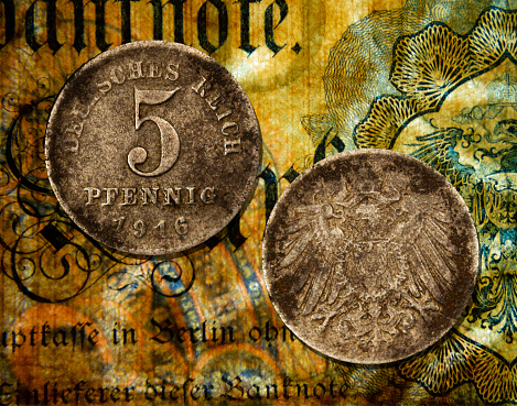 A close-up photo of  an old German mark, five pfennig coin from 1916