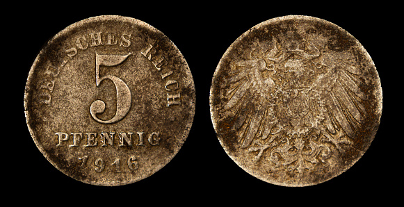 A close-up photo of an old German mark, five pfennig coin from 1916