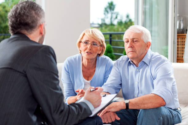 istock Senior couple talking with financial advisor 1977792031
