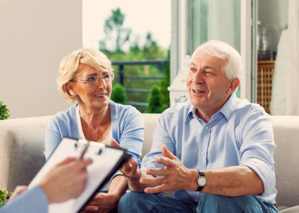 istock Senior couple talking with financial advisor 1977793089