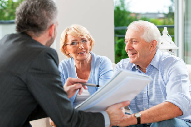 istock Senior couple talking with financial advisor 1977794213