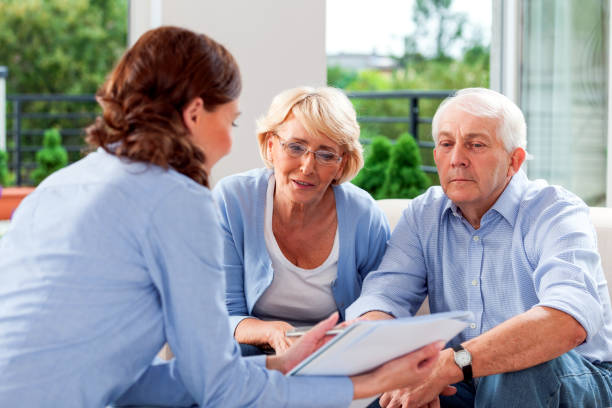 istock Senior couple talking with insurance agent 1977794743