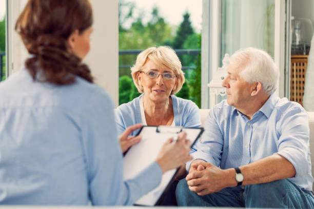 istock Senior couple talking with insurance agent 1977795826