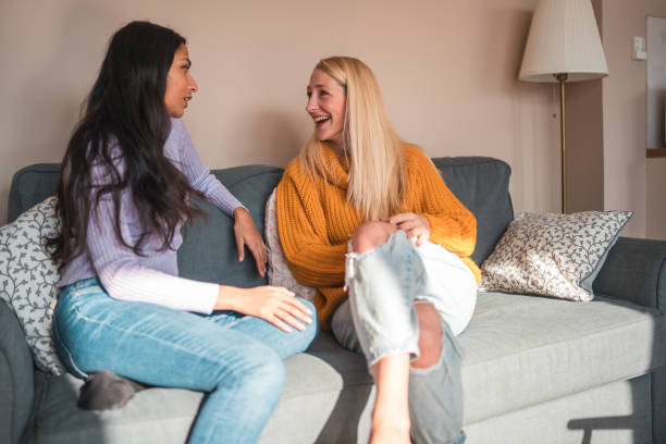 istock Diverse Female Friends Enjoying Conversation Indoors 1977795833