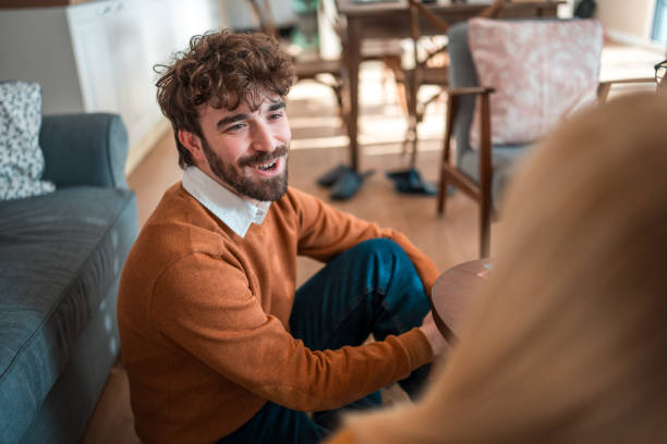 istock Diverse Friends Enjoying Casual Gathering Indoors 1977797450