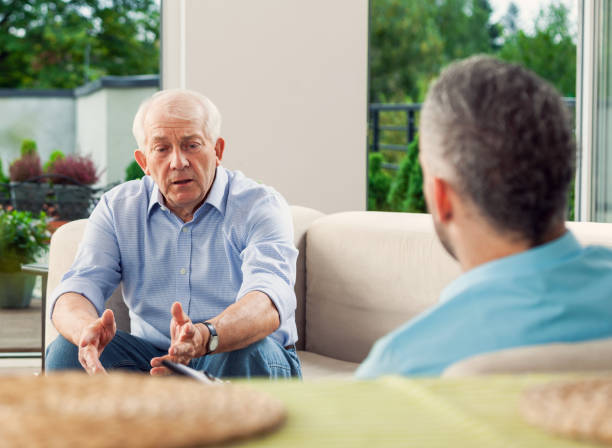 istock Worried senior man talking with insurance agent 1977797467