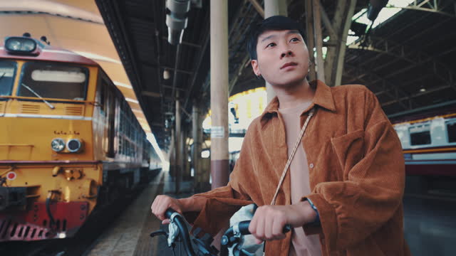 Asian young man travel with bicycle