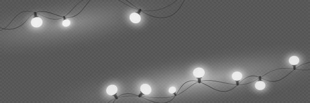 istock Glowing Christmas garland and lights. On a transparent background. 1977813919