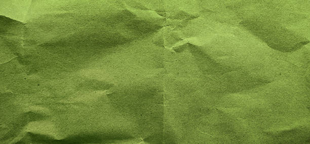 istock grunge old green paper texture use as background with blank space for design. kraft green wrinkle recycle paper background. rough paper texture for natural concept. 1977826390