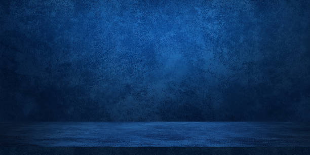 istock blue navy color studio background with light from above. leather texture backdrop for design. space for selling products on the website. banner background for advertising. 1977826974