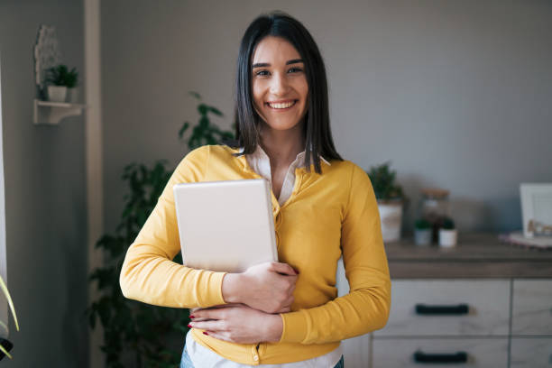 istock Young woman or student holding fascicle 1977841877
