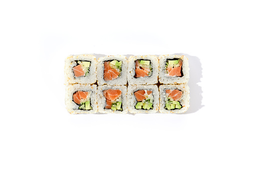 Sesame-Encrusted Salmon and Avocado Sushi Roll on White Background.