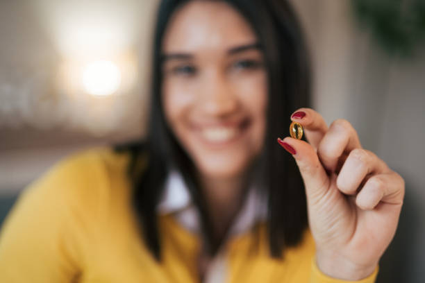 istock Portrait od young woman taking her medicine. 1977855574