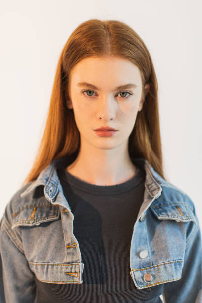Close-Up Portrait Of Sad Young Woman Against Black Background