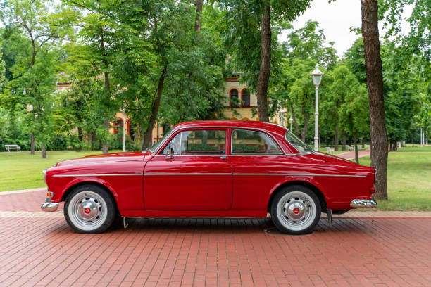 Side view of beautiful Volvo Amazon (2 door sedan) in red color, Palic, Serbia, 02.07.2023