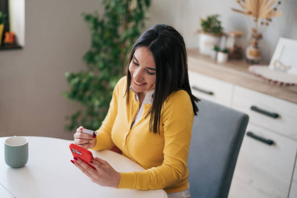 istock Young woman shopping online 1977894323