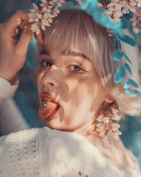 istock Blonde woman on spring tree background. Fine art portrait 1977911097