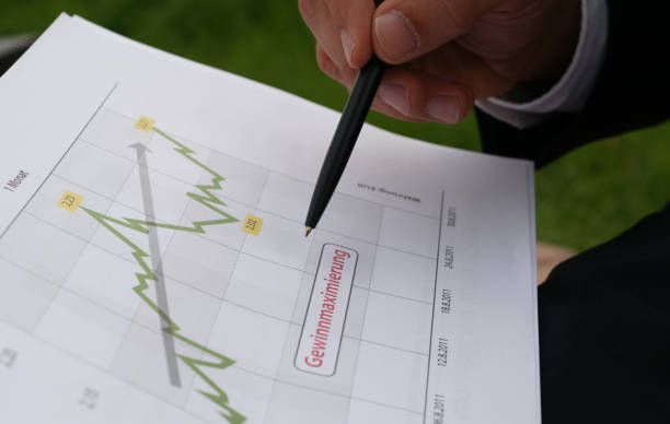 istock Businessman evaluates company data and checks charts and values 1977921528