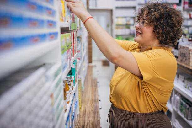 istock Woman shopping for medicine 1977937180