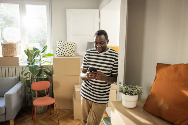 istock Young man moving in new house 1977952758