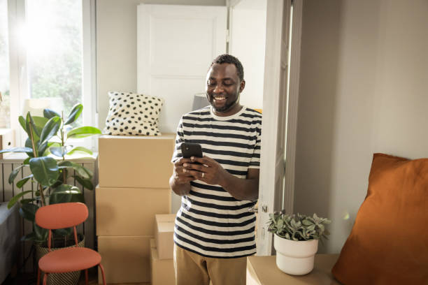 istock Young man moving in new house 1977952760