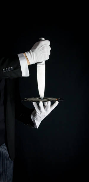 istock Butler Holding Sharp Knife on Serving Tray 1977953291